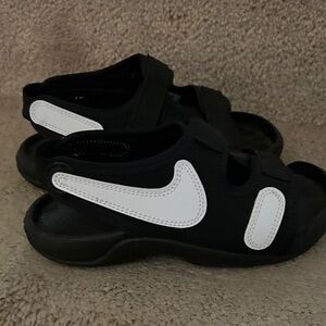 Nike Kids Black Sandals with White Swoosh Accents